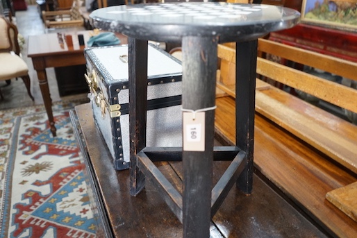 A circular marble topped games table, diameter 40cm, height 54cm, together with a small metal trunk
